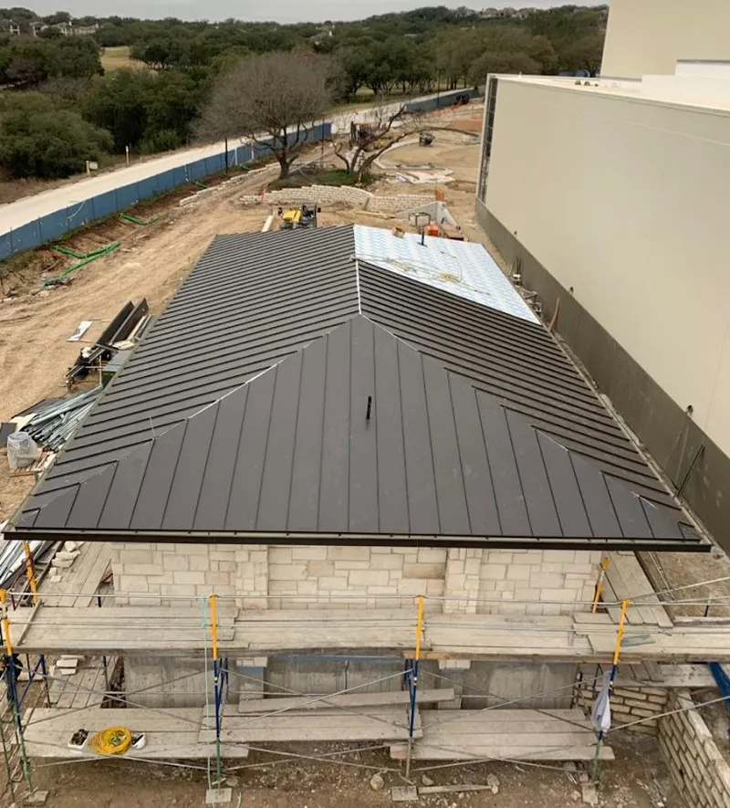 Metal roof new construction with scaffolding in Franklin Town